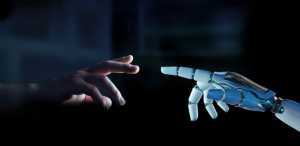 Os impasses éticos e morais do uso de Inteligência Artificial: imagem de uma mão humana tocando uma mão artificial